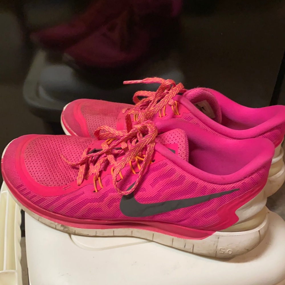 Pink Nike running shoes